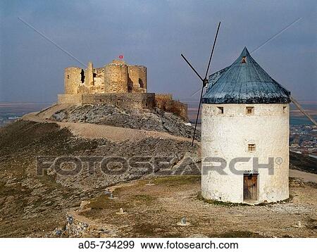 Windmill and castle, Consuegra. Toledo province, Castilla-La Mancha, Spain View Large Photo Image Stock Photo - Windmill and castle, Consuegra. Toledo province, Castilla-La Mancha, Spain. Fotosearch