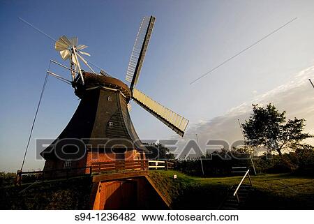 Stock Image - Windmill in Krokau town, Schleswig-Holstein, Germany. Fotosearch