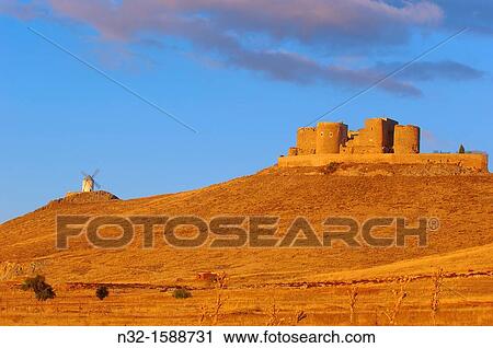 Stock Image - Windmills and Castle of the Knights of St. John of Jerusalem, Consuegra, Toledo province, Route of Don Quixote, Castilla-La Mancha, Spain. Fotosearch