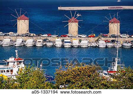 Windmills in Mandraki harbour Rhodes city, Rhodes Island, Greece. View Large Photo Image Picture - Windmills in Mandraki harbour Rhodes city, Rhodes Island, Greece.. Fotosearch