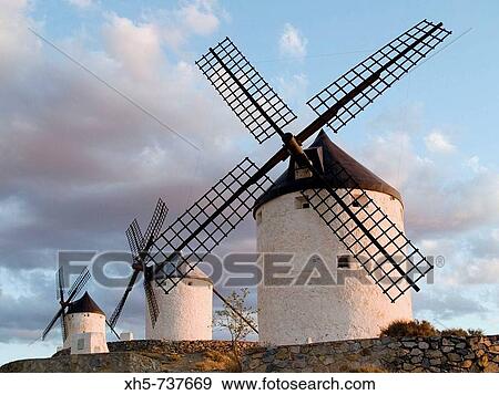 Windmills in the evening, Consuegra. Toledo province, Castilla-La Mancha, Spain View Large Photo Image Stock Photo - Windmills in the evening, Consuegra. Toledo province, Castilla-La Mancha, Spain. Fotosearch