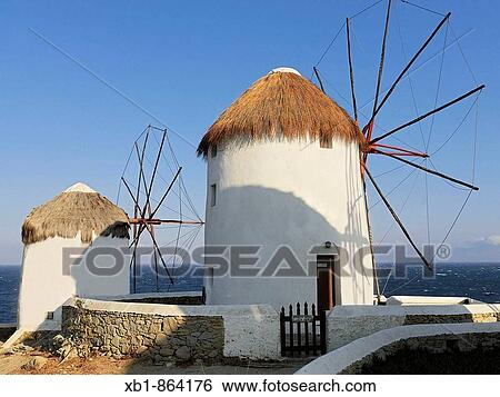 Windmills, Kato Mili, of Mykonos, Agean Sea, Greece View Large Photo Image Stock Photograph - Windmills, Kato Mili, of Mykonos, Agean Sea, Greece. Fotosearch