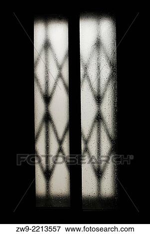 Window and wet glass with metallic shutting, Madrid, Spain View Large Photo Image Stock Photo - Window and wet glass with metallic shutting, Madrid, Spain. Fotosearch