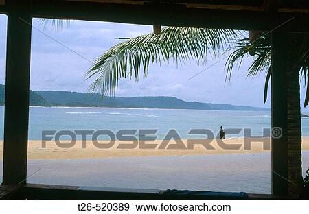 Window looking to the beach from a cabin in Monogaga river beach. Fisherman on the shore. Ivory Coast. View Large Photo Image Stock Photo - Window looking to the beach from a cabin in Monogaga river beach. Fisherman on the shore. Ivory Coast.. Fotosearch