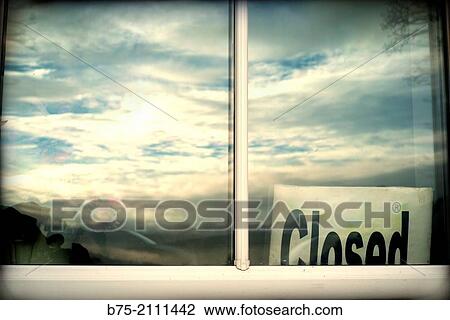 Window of a BB with a poster of Closed with clouds and sky reflected in the glass. England, UK, Europe. View Large Photo Image Stock Image - Window of a BB with a poster of Closed with clouds and sky reflected in the glass. England, UK, Europe.. Fotosearch