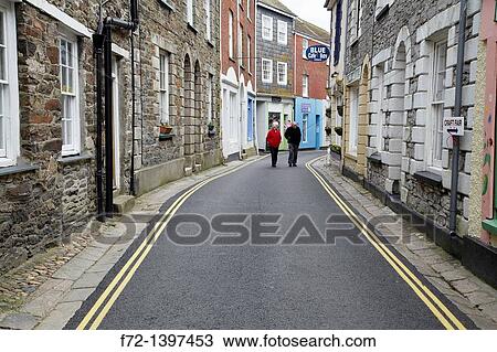 Window shopping on a narrow main street, Mevagissey, Cornwall, England, United Kingdom View Large Photo Image Stock Image - Window shopping on a narrow main street, Mevagissey, Cornwall, England, United Kingdom. Fotosearch