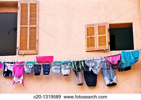 Windows with hanging colored washing. Le Panier Quarter, Marseille, Bouches du Rhone, 13, France. View Large Photo Image Stock Photo - Windows with hanging colored washing. Le Panier Quarter, Marseille, Bouches du Rhone, 13, France.. Fotosearch