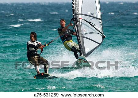 Stock Photo - Windsurfer and kiteboarder. Fotosearch