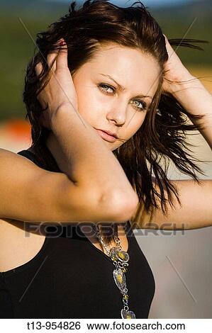 Windy day, portrait of brunette young woman View Large Photo Image Stock Photograph - Windy day, portrait of brunette young woman. Fotosearch