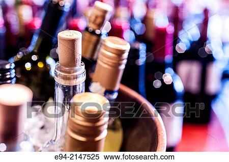 Stock Photography - Wine bottles on a counter.. Fotosearch