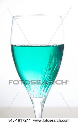 Wine glass with turquoise liquid View Large Photo Image Stock Image - Wine glass with turquoise liquid. Fotosearch