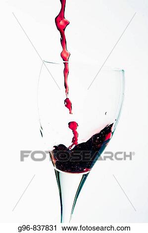 Wine pouring into a wineglass View Large Photo Image Stock Image - Wine pouring into a wineglass. Fotosearch