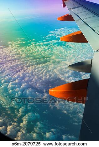 wing of a plane in flight. View Large Photo Image Stock Photography - wing of a plane in flight.. Fotosearch
