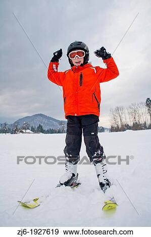 Stock Photo - Winter landscape - boy on skies, Slovenia.. Fotosearch