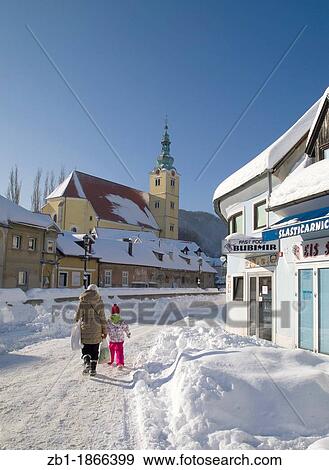 Stock Photo - Winter scenery from Croatia: St Anastasia church and houses covered with fresh snow, city of Samobor, central Croatia. Fotosearch