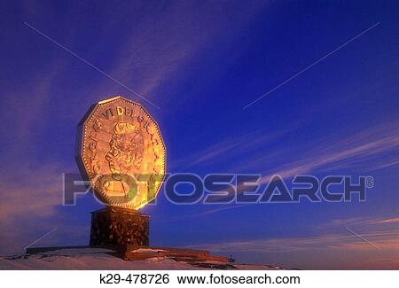 Stock Photograph - Winter skies and evening light on the Big Nickel. Sudbury. Ontario. Canada.. Fotosearch