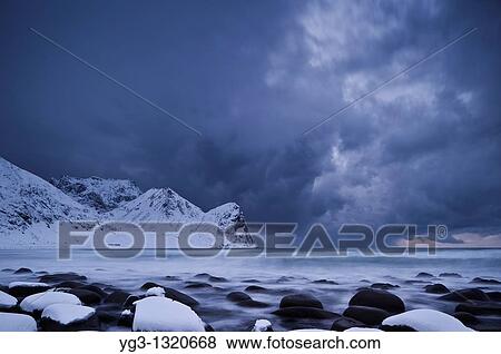Winter storm over snow covered beach, Unstad, Lofoten islands, Norway View Large Photo Image Stock Photo - Winter storm over snow covered beach, Unstad, Lofoten islands, Norway. Fotosearch