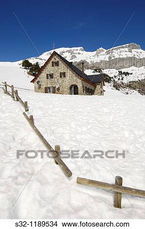 Picture - winter view from mountain lodge Lizara in Aragues del Puerto, Pyrenees, Huesca, Aragon, Spain. Fotosearch