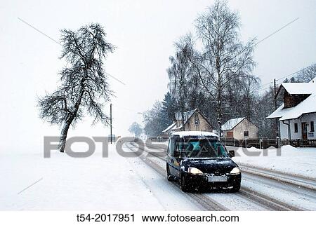 Wintry road at the entrance of a village in Bavaria View Large Photo Image Stock Image - Wintry road at the entrance of a village in Bavaria. Fotosearch