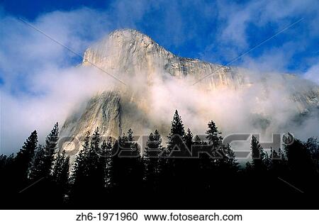 Wispy clouds around El Capitan, Yosemite Valley, Yosemite National Park, California USA. View Large Photo Image Stock Image - Wispy clouds around El Capitan, Yosemite Valley, Yosemite National Park, California USA.. Fotosearch