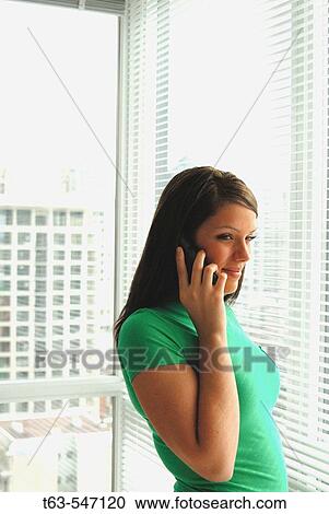 Woman 20 yrs old on telephone at home. View Large Photo Image Stock Image - Woman 20 yrs old on telephone at home.. Fotosearch