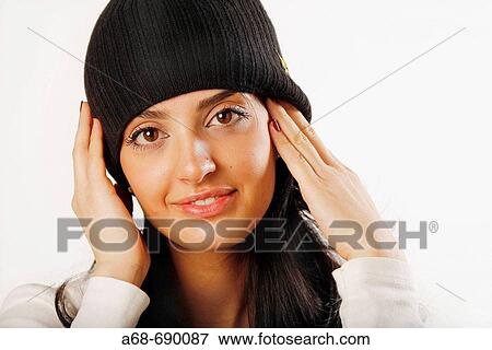 Woman, 30 years old, with cap View Large Photo Image Stock Photo - Woman, 30 years old, with cap. Fotosearch