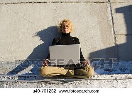 Stock Image - Woman 40's with laptop. Fotosearch