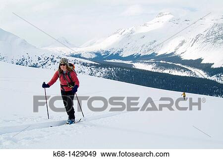 woman, 50, back country skiing in the Rocky Mountains in Banff National Park, Alberta, Canada View Large Photo Image Stock Photo - woman, 50, back country skiing in the Rocky Mountains in Banff National Park, Alberta, Canada. Fotosearch