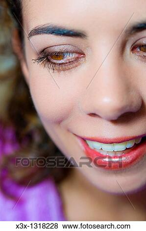 Stock Photo - Woman after make up session smiling. Fotosearch