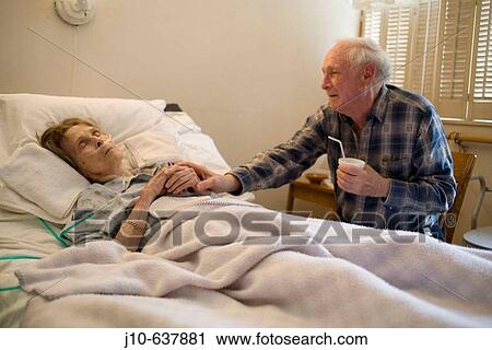 Woman age 89 dying, Hospice care, with friend. Poughkeepsie, NY. USA. View Large Photo Image Stock Image - Woman age 89 dying, Hospice care, with friend. Poughkeepsie, NY. USA.. Fotosearch