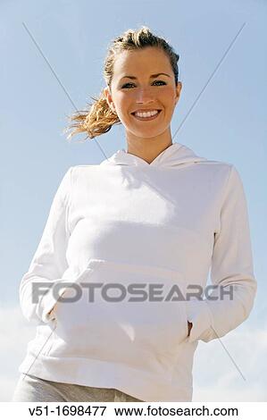 Stock Photo - woman, air, exercise, beach. Fotosearch