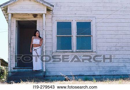 woman alone outside old house View Large Photo Image Stock Image - woman alone outside old house. Fotosearch