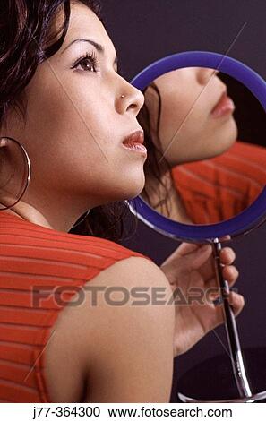 Woman and a mirror View Large Photo Image Stock Image - Woman and a mirror. Fotosearch