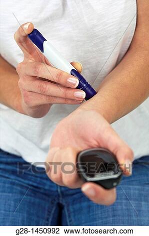 Woman and blood glucose test to treat diabetes View Large Photo Image Stock Image - Woman and blood glucose test to treat diabetes. Fotosearch