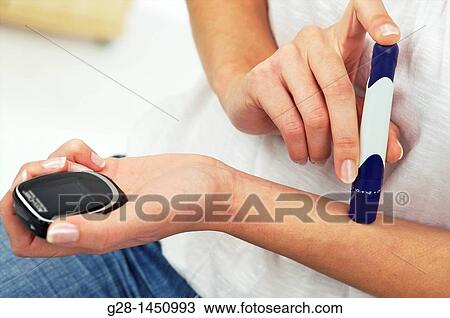 Stock Image - Woman and blood glucose test to treat diabetes. Fotosearch