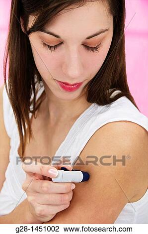 Woman and blood glucose test to treat diabetes View Large Photo Image Stock Image - Woman and blood glucose test to treat diabetes. Fotosearch