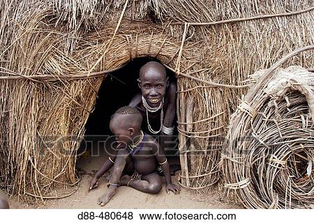 Woman and child. Karo ethnic group. Lower Omo river basin. Gamo Gofa region. South west Ethiopia View Large Photo Image Stock Photo - Woman and child. Karo ethnic group. Lower Omo river basin. Gamo Gofa region. South west Ethiopia. Fotosearch