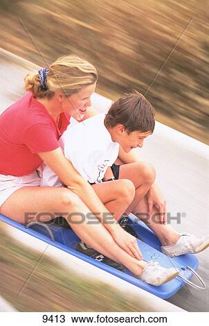 Woman and child on slide View Large Photo Image Stock Image - Woman and child on slide. Fotosearch