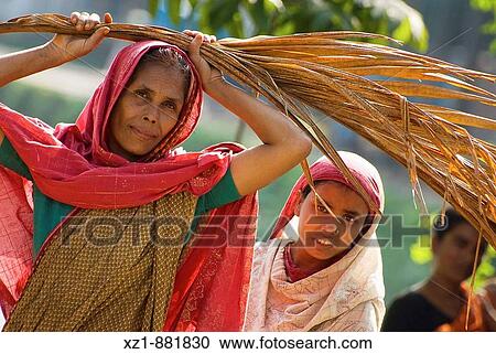 Woman and child on the road to Puthia, Bangladesh View Large Photo Image Stock Image - Woman and child on the road to Puthia, Bangladesh. Fotosearch