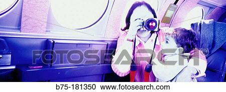 Woman and child, taking a photo View Large Photo Image Stock Image - Woman and child, taking a photo. Fotosearch