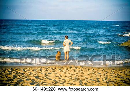 Woman and dog Cabo de Gata, Almeria, Spain View Large Photo Image Stock Photo - Woman and dog Cabo de Gata, Almeria, Spain. Fotosearch