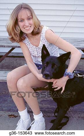 Stock Image - Woman and dog. Fotosearch