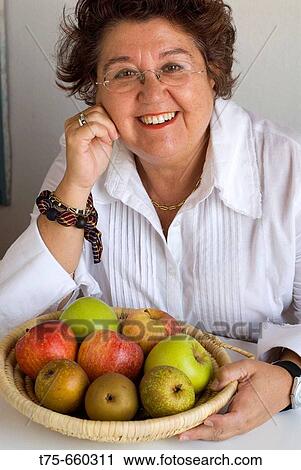 Woman and fruit-dish View Large Photo Image Stock Image - Woman and fruit-dish. Fotosearch