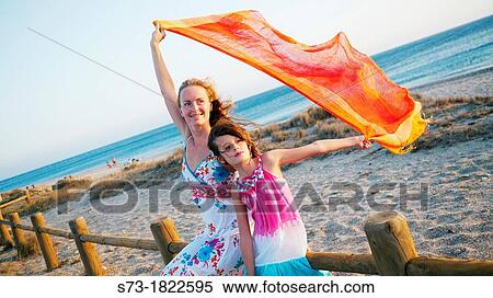 Woman and girl in a Cabo Gata beach, Almeria, Andalusia, Spain View Large Photo Image Stock Photography - Woman and girl in a Cabo Gata beach, Almeria, Andalusia, Spain. Fotosearch