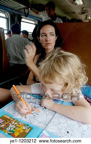 Woman and her daughter inside the carriage of a passenger train travelling from Beijing to Datong, China. View Large Photo Image Stock Image - Woman and her daughter inside the carriage of a passenger train travelling from Beijing to Datong, China.. Fotosearch