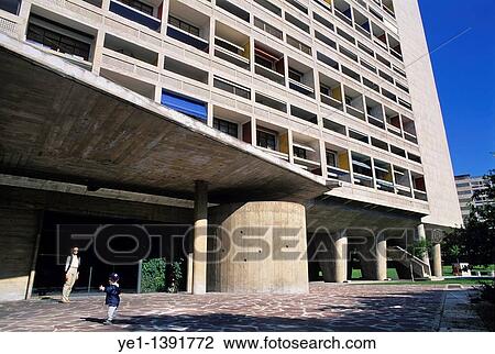 Woman and her son entering Unit? d? Habitation designed by the architect Le Corbusier, Marseille, France View Large Photo Image Stock Image - Woman and her son entering Unit? d? Habitation designed by the architect Le Corbusier, Marseille, France. Fotosearch