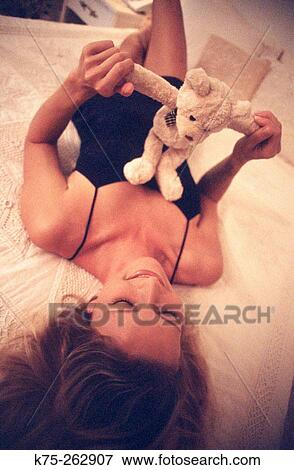 Woman and her teddy bear View Large Photo Image Stock Photo - Woman and her teddy bear. Fotosearch