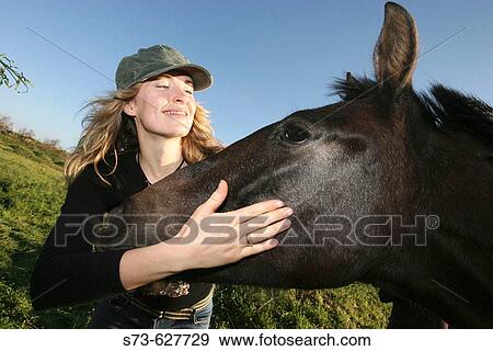 Woman and horse View Large Photo Image Stock Photo - Woman and horse. Fotosearch