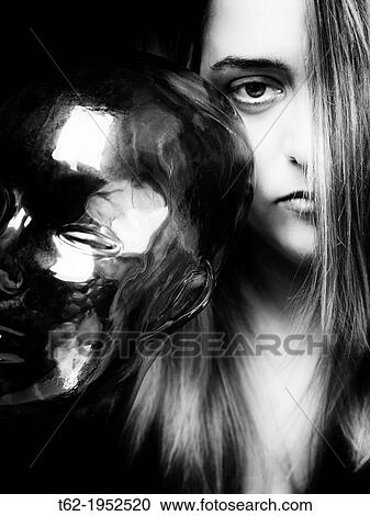 Stock Image - Woman and mask.. Fotosearch