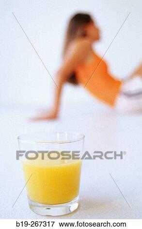 Woman and orange juice View Large Photo Image Stock Photo - Woman and orange juice. Fotosearch